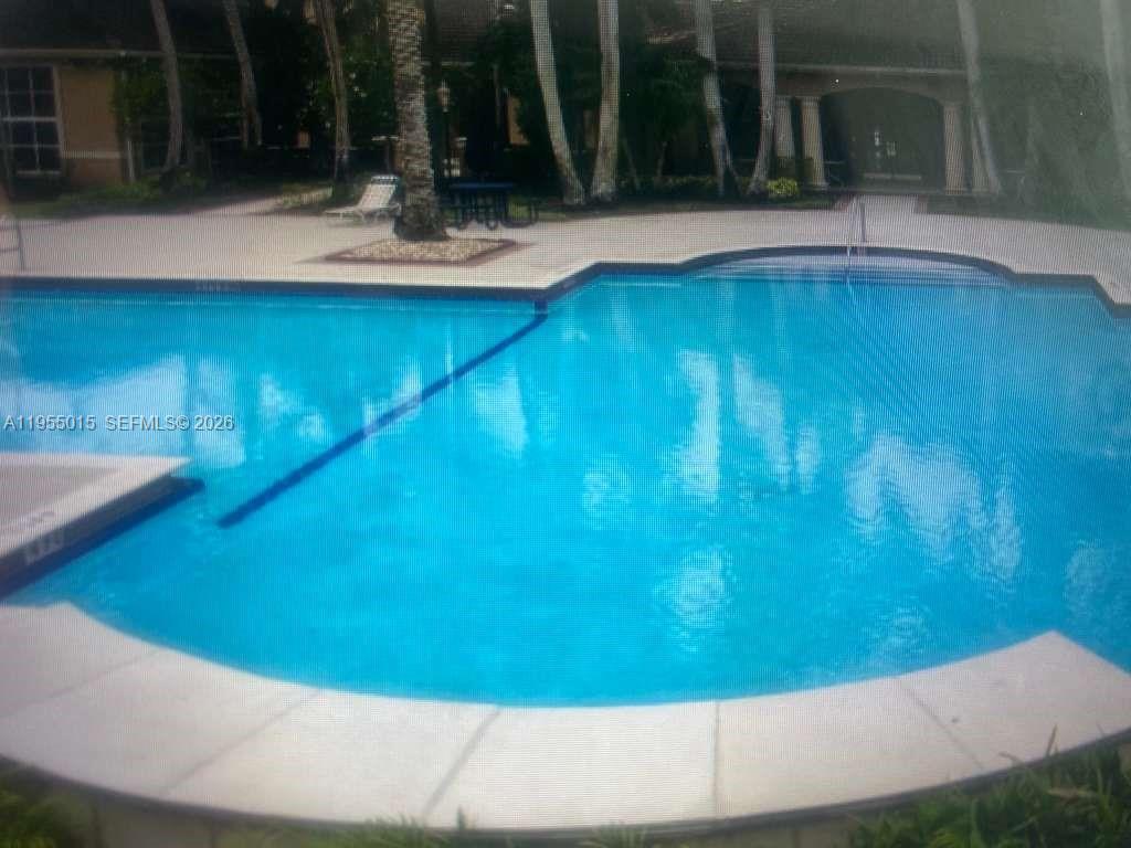 7930 North Nob Hill Road, Unit 304 Tamarac, FL 33321 - Photo 29 of 30 a view of swimming pool from a balcony