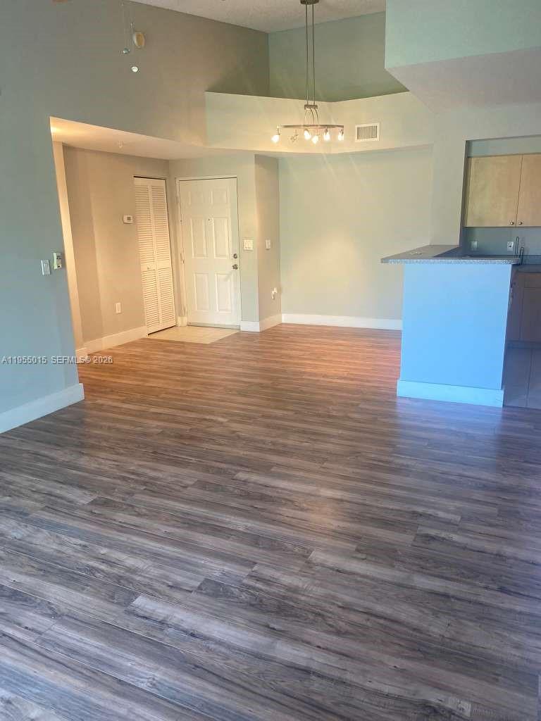 7930 North Nob Hill Road, Unit 304 Tamarac, FL 33321 - Photo 8 of 30 a view of empty room with wooden floor