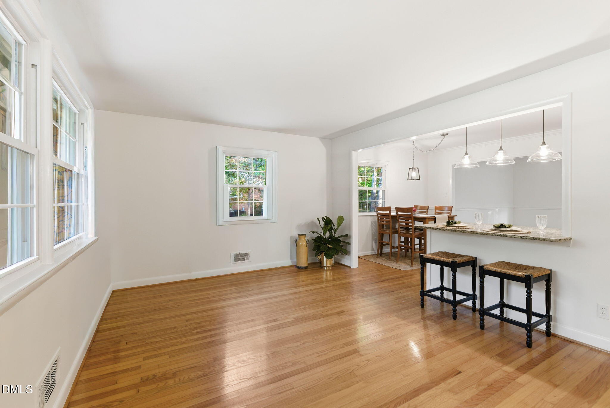 531 West Cornwall Road Cary, NC 27511 - Photo 8 of 77 a room with lots of wooden furniture and a dining table with wooden floor