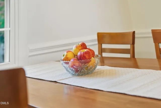 a view of a vase of flowers sitting next to a window