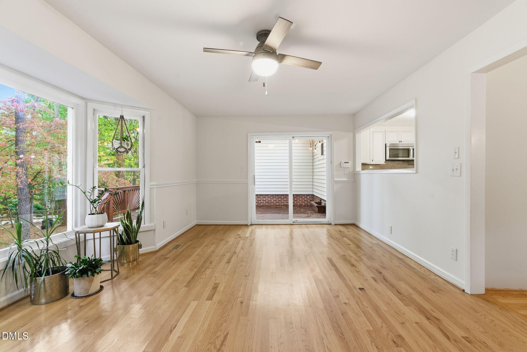 531 West Cornwall Road Cary, NC 27511 - Photo 26 of 77 a view of an empty room with wooden floor and a window