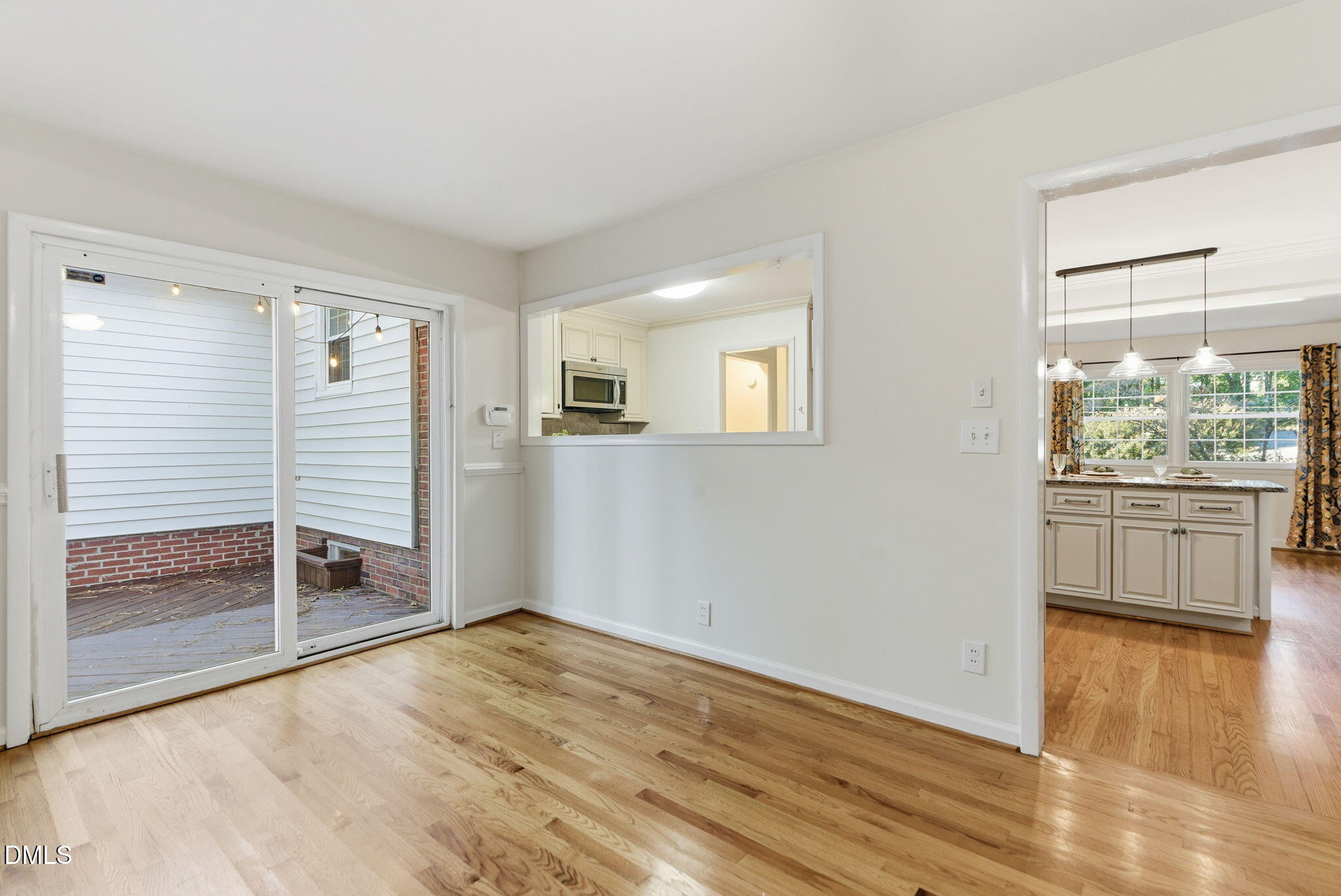 531 West Cornwall Road Cary, NC 27511 - Photo 27 of 77 a view of empty room with wooden floor and fan