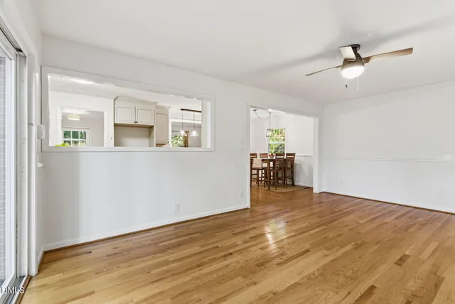 a spacious bathroom with a toilet sink and mirror