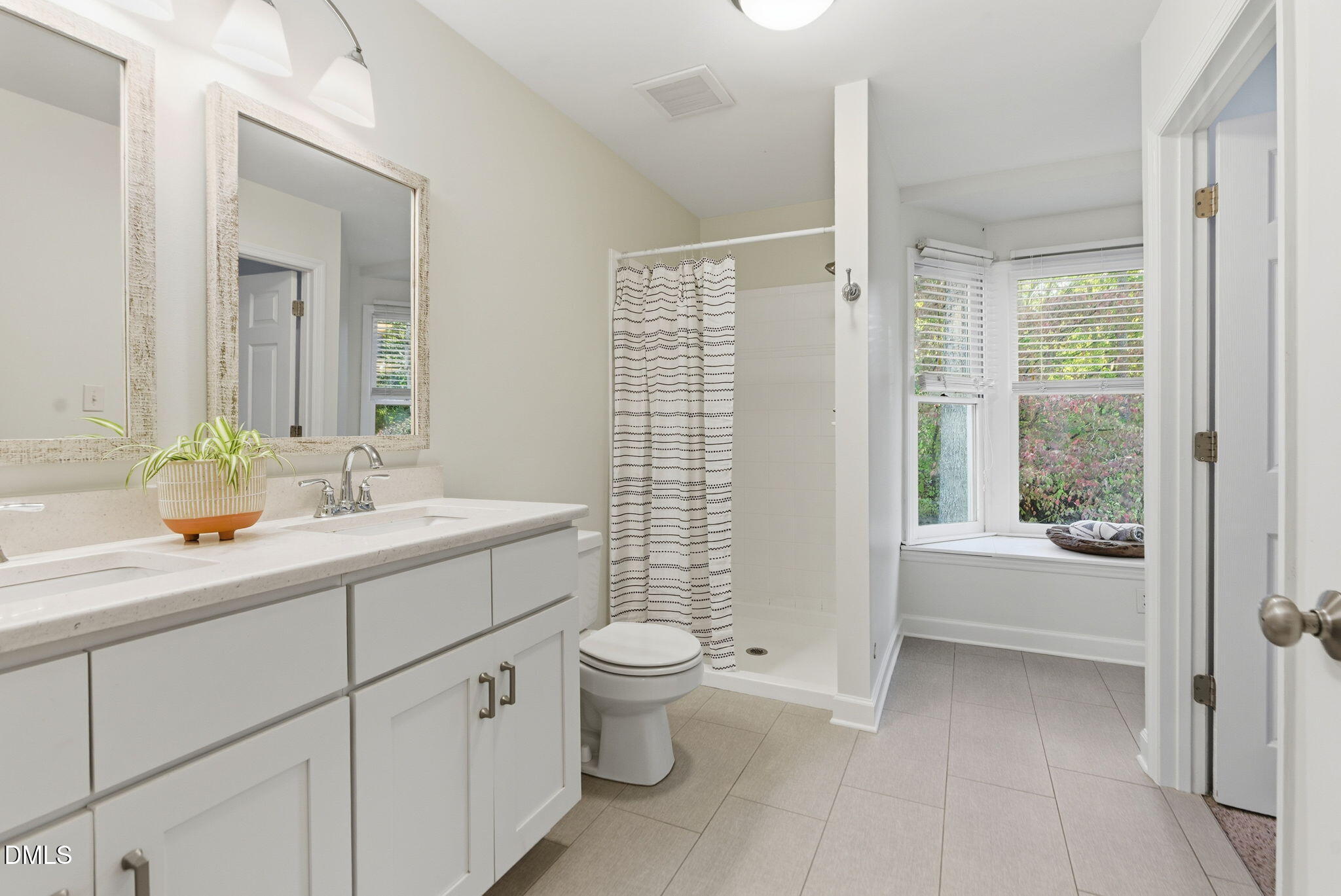531 West Cornwall Road Cary, NC 27511 - Photo 38 of 77 a bathroom with a double vanity sink toilet and shower