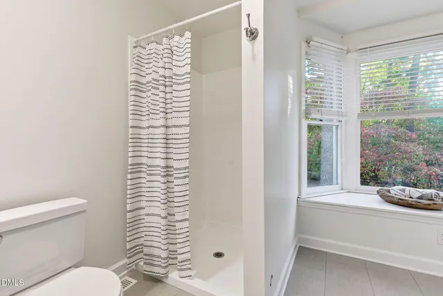 a view of a chairs and table on the wooden floor