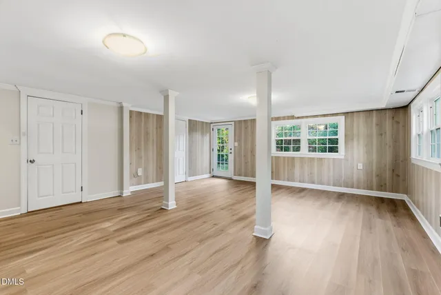 a house that has a tree in front of the house