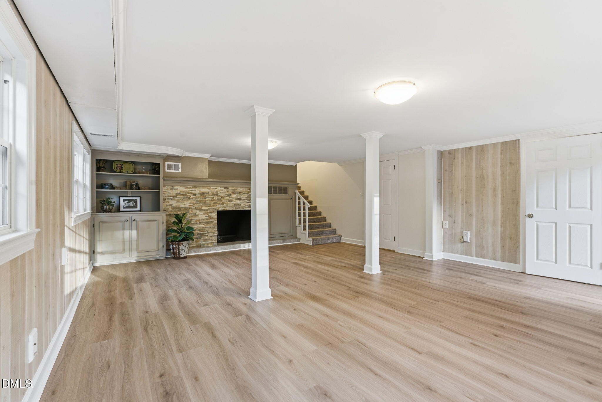 531 West Cornwall Road Cary, NC 27511 - Photo 50 of 77 an empty room with wooden floor and fireplace