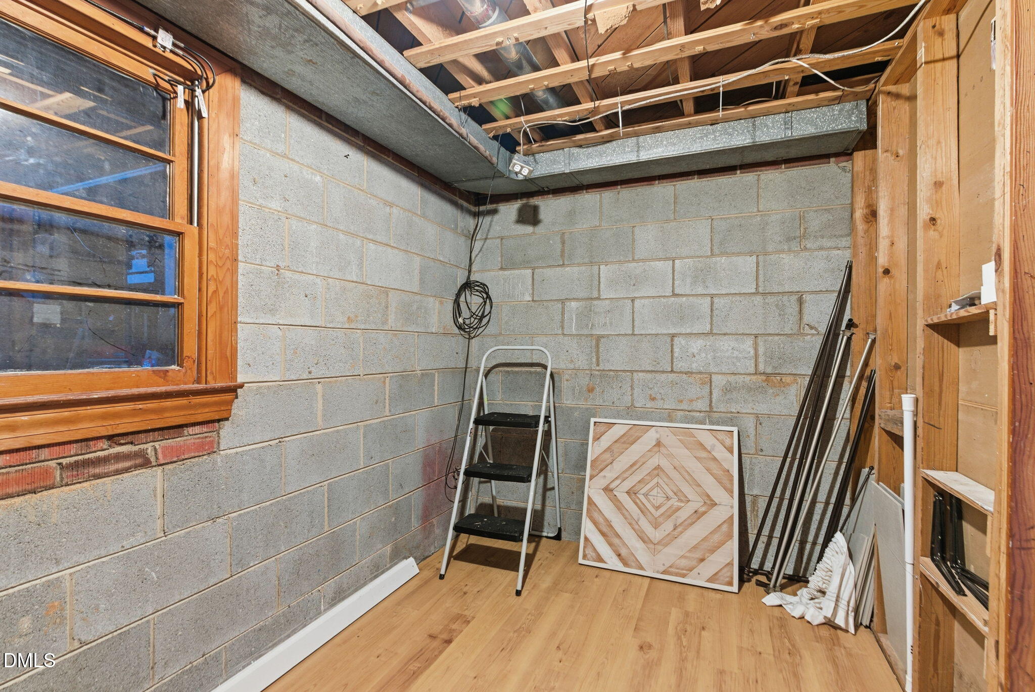 531 West Cornwall Road Cary, NC 27511 - Photo 55 of 77 a view of an empty room with wooden floor and a window