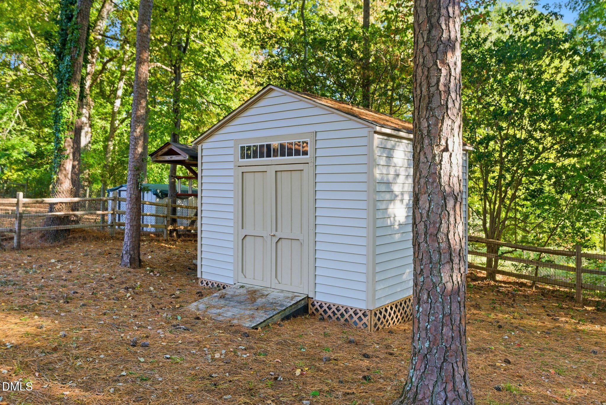 531 West Cornwall Road Cary, NC 27511 - Photo 64 of 77 a view of a small house with large tree next to a yard