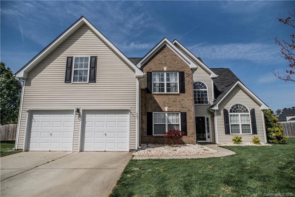 1735 Newland Road Denver, NC 28037 - Photo 1 of 24 a front view of a house with a yard and garage