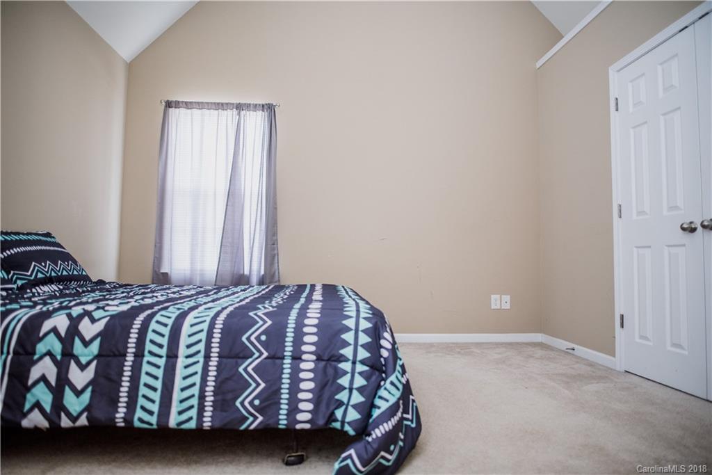 1735 Newland Road Denver, NC 28037 - Photo 15 of 24 a bedroom with a bed and a window