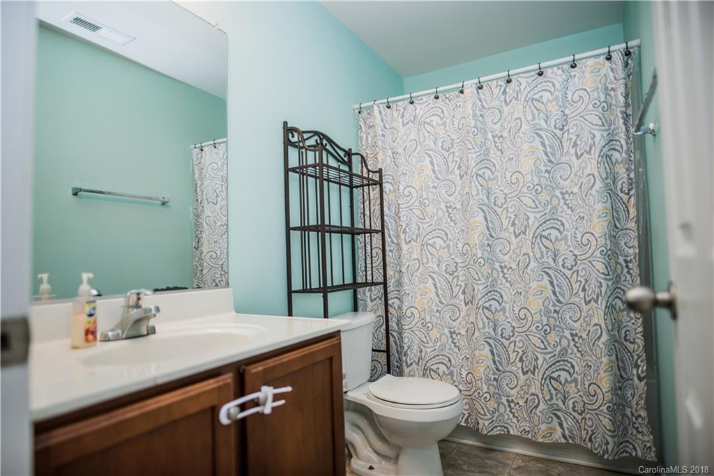 1735 Newland Road Denver, NC 28037 - Photo 18 of 24 a bathroom with a sink toilet and shower