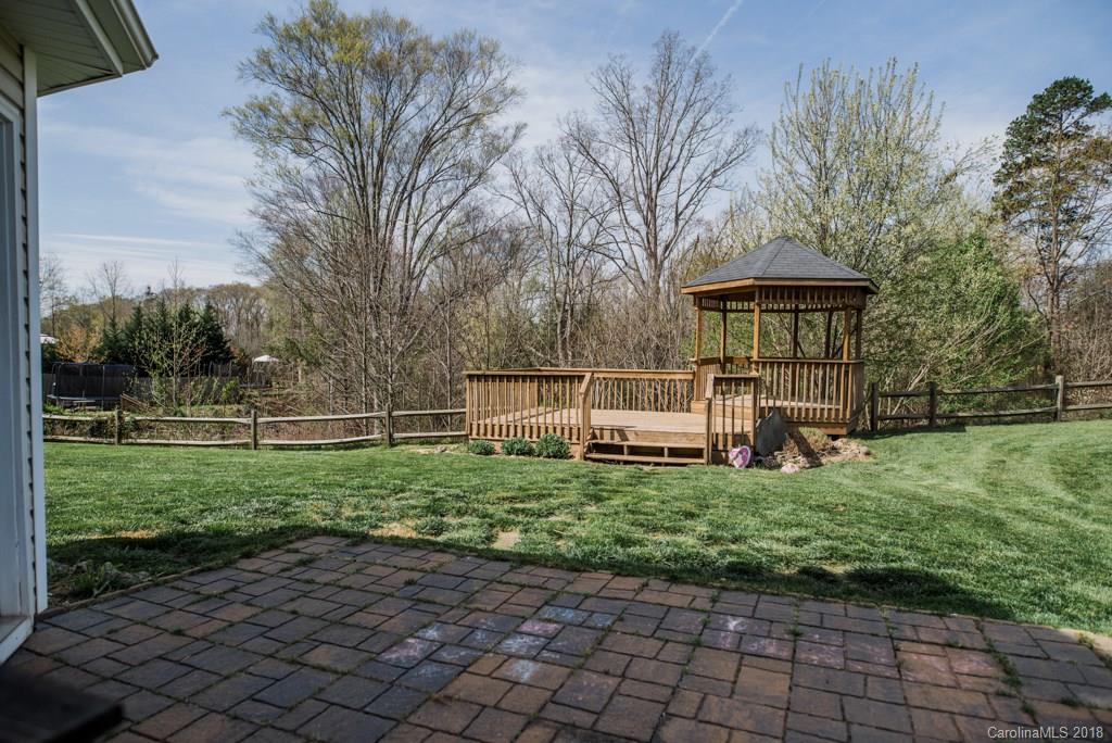 1735 Newland Road Denver, NC 28037 - Photo 23 of 24 a view of a house with backyard and a tree