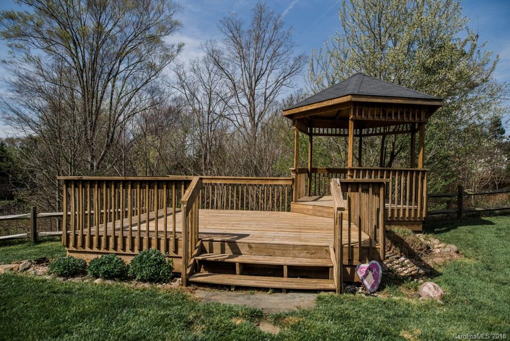 1735 Newland Road Denver, NC 28037 - Photo 24 of 24 a view of a deck with a fence and a floor to ceiling window