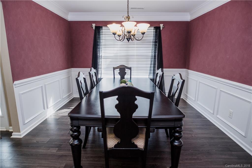 1735 Newland Road Denver, NC 28037 - Photo 9 of 24 a view of a dining room with furniture window and wooden floor