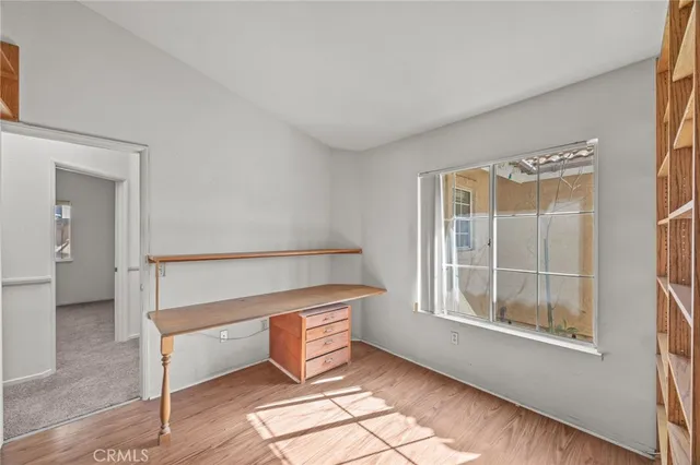 a view of staircase with white walls and a window