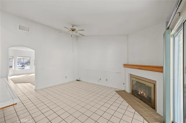 a view of kitchen with stainless steel appliances cabinets and outdoor space