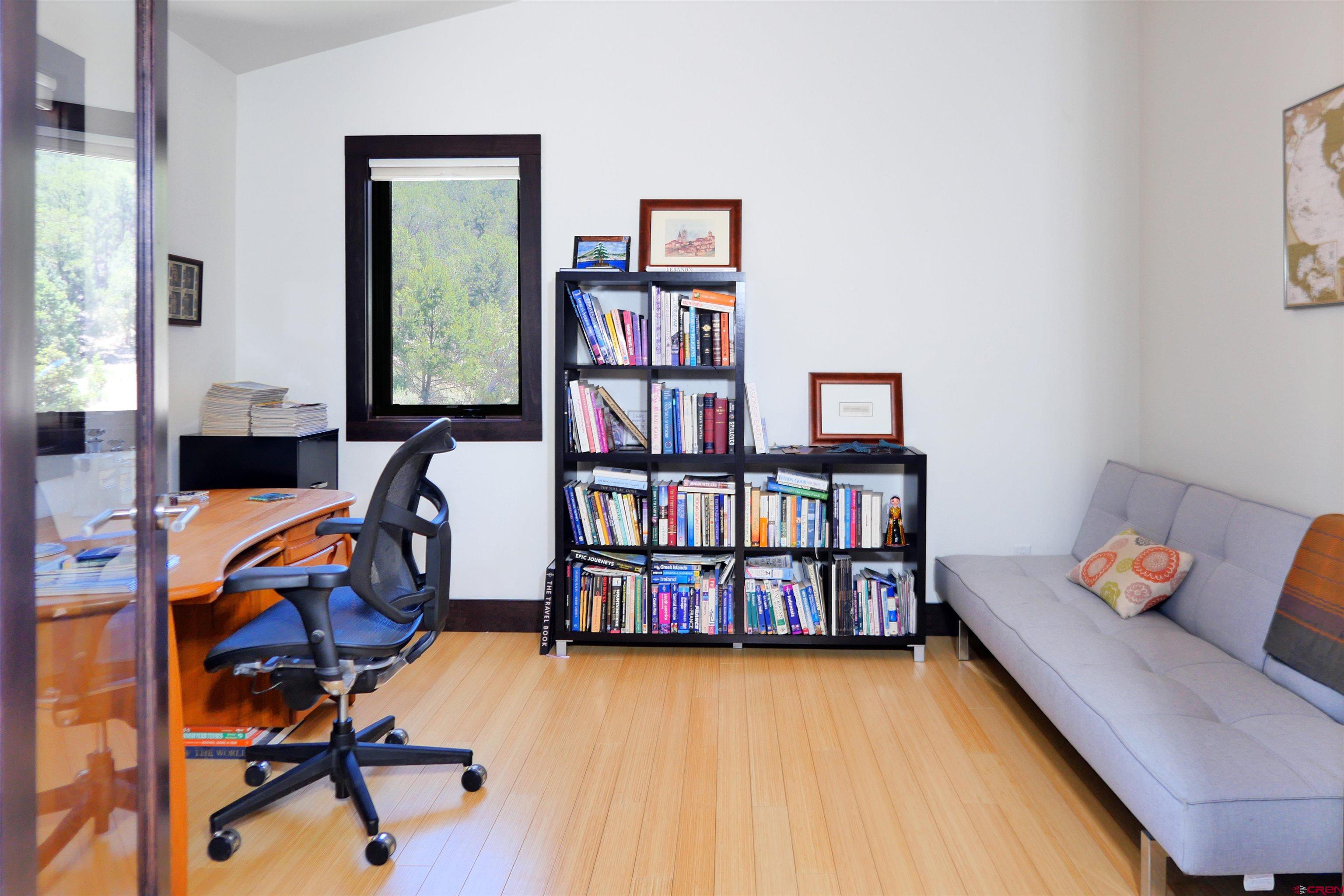 456 Ridge Road Montrose, CO 81403 - Photo 19 of 24 a reading room with furniture and book shelf