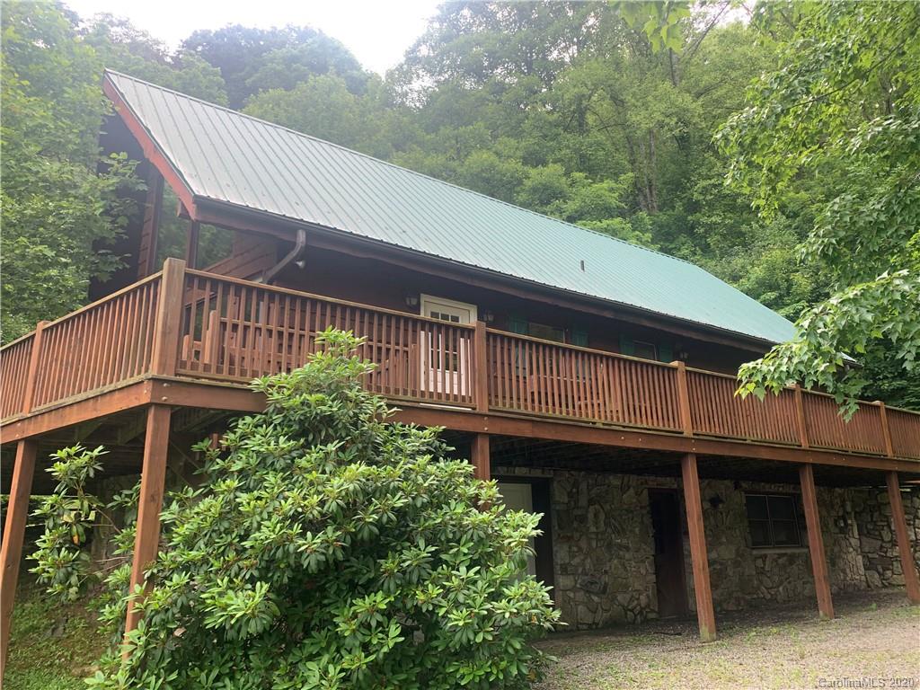 604 Price Town Road Clyde, NC 28721 - Photo 1 of 4 a view of a house with a yard balcony and wooden fence