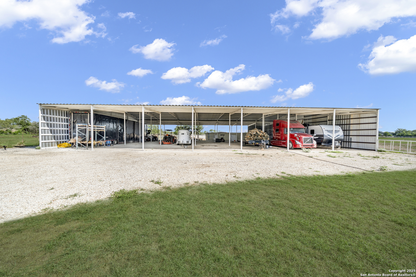11791 Kinney Road Atascosa, TX 78002 - Photo 15 of 28 a view of a yard and a garage