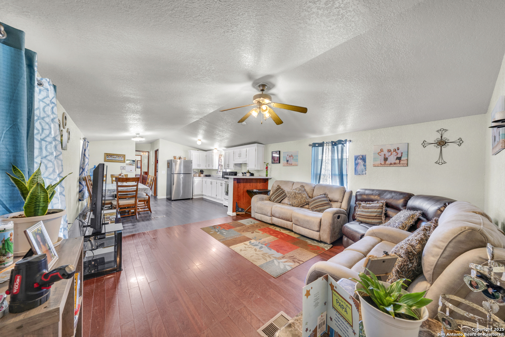 11791 Kinney Road Atascosa, TX 78002 - Photo 17 of 28 a living room with furniture kitchen view and a large window