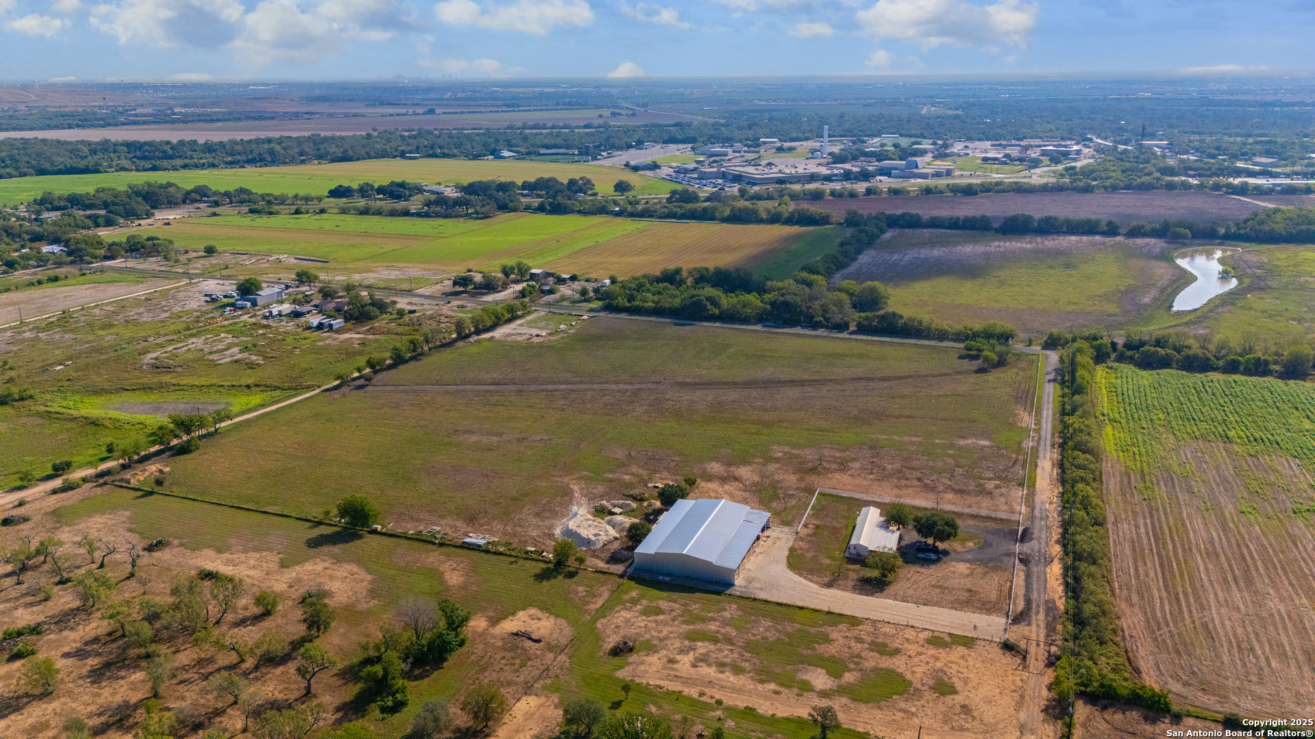 11791 Kinney Road Atascosa, TX 78002 - Photo 4 of 28 a view of a lake with a yard