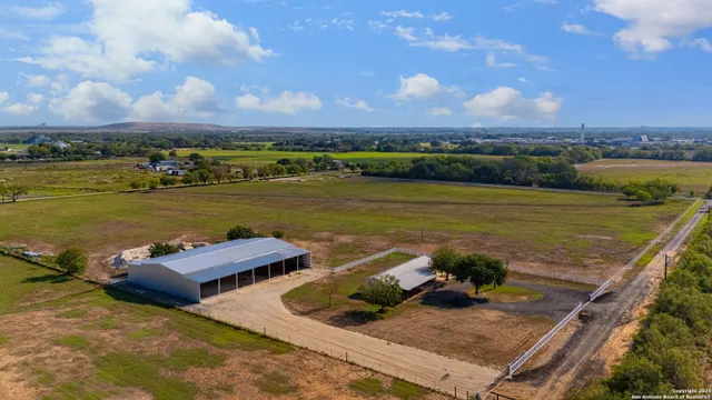 an aerial view of a house with a ocean view