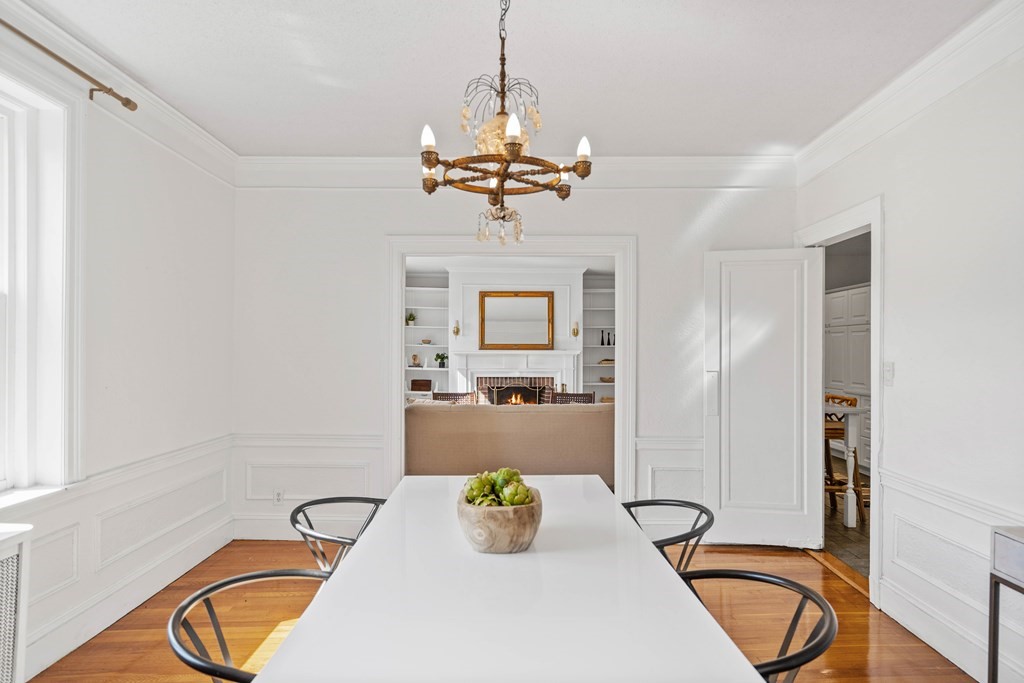 311 Tappan Street, Unit 2 Brookline, MA 02445 - Photo 11 of 26 a bathroom with a granite countertop sink a mirror and a shower