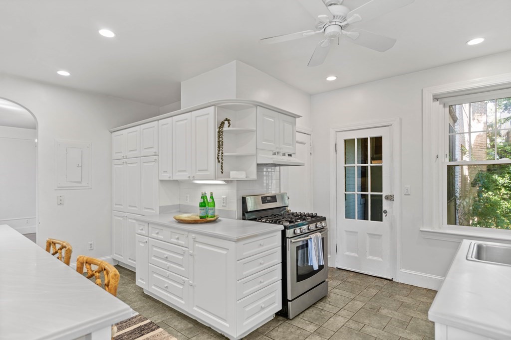 311 Tappan Street, Unit 2 Brookline, MA 02445 - Photo 14 of 26 a kitchen that has a lot of cabinets in it and wooden floor