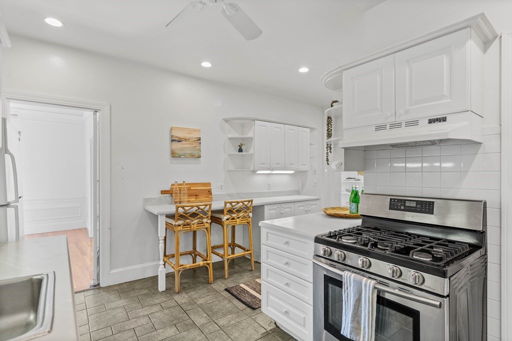 311 Tappan Street, Unit 2 Brookline, MA 02445 - Photo 15 of 26 a stove top oven sitting inside of a kitchen