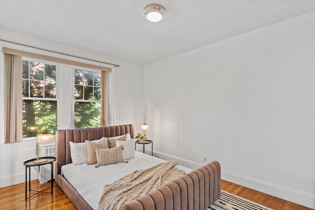 311 Tappan Street, Unit 2 Brookline, MA 02445 - Photo 19 of 26 a bedroom with a bed and a window