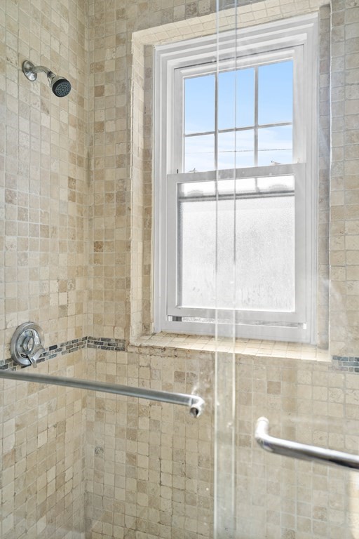 311 Tappan Street, Unit 2 Brookline, MA 02445 - Photo 23 of 26 a bathroom with a window and a shower