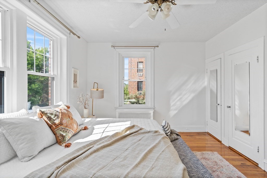 311 Tappan Street, Unit 2 Brookline, MA 02445 - Photo 7 of 26 a bedroom with a bed and a window