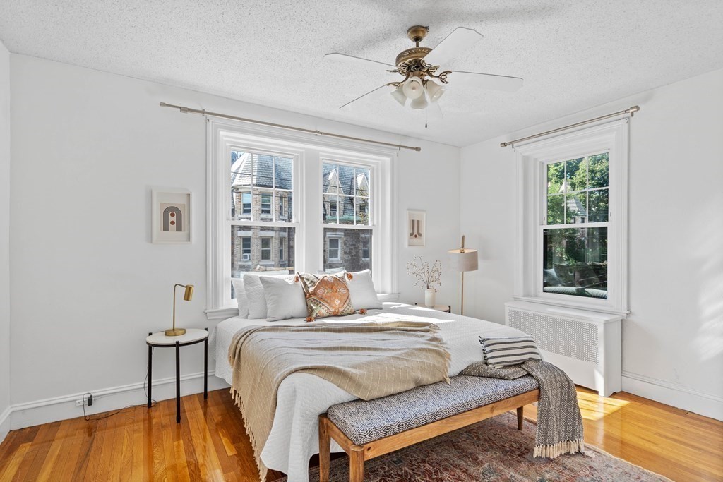 311 Tappan Street, Unit 2 Brookline, MA 02445 - Photo 8 of 26 a bedroom with a bed and a table