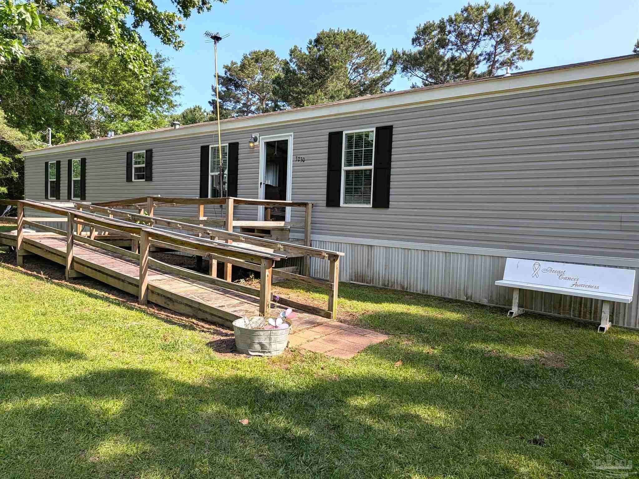 3230 Mason Road McDavid, FL 32568 - Photo 1 of 45 a view of a house with a backyard
