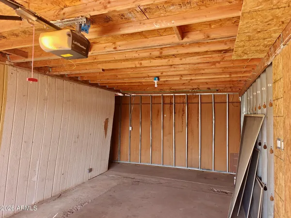 a view of a room with wooden walls