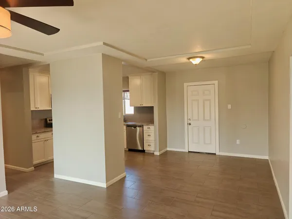 a view of a kitchen cabinets and wooden floor