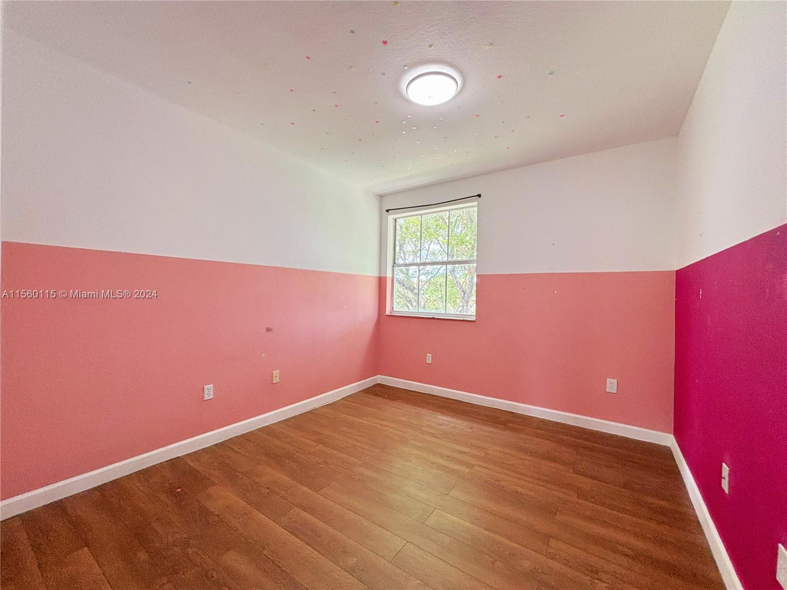 10860 Northwest 84th Street Doral, FL 33178 - Photo 14 of 19 an empty room with a window