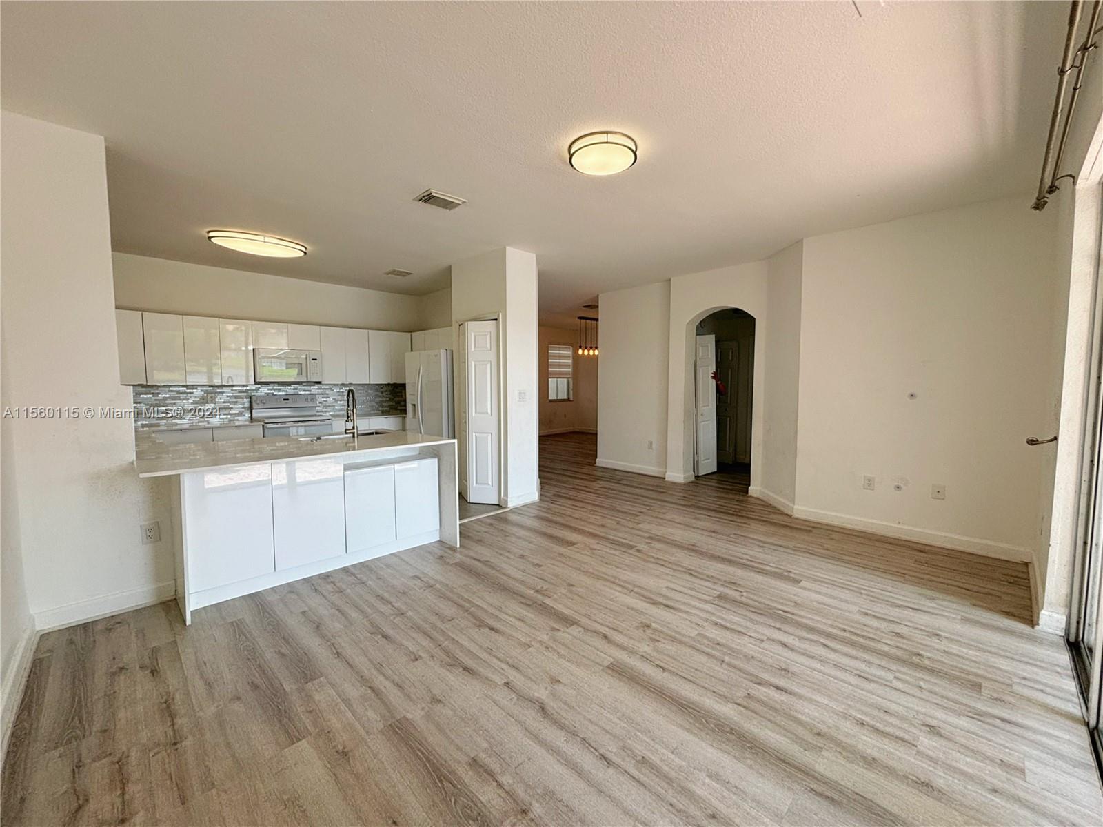 10860 Northwest 84th Street Doral, FL 33178 - Photo 19 of 19 a view of kitchen with wooden floor