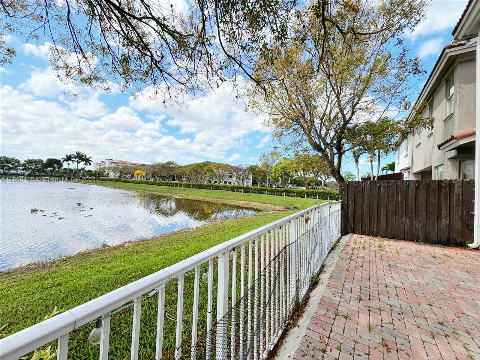 10860 Northwest 84th Street Doral, FL 33178 - Photo 7 of 19 a view of balcony with outdoor space and lake view