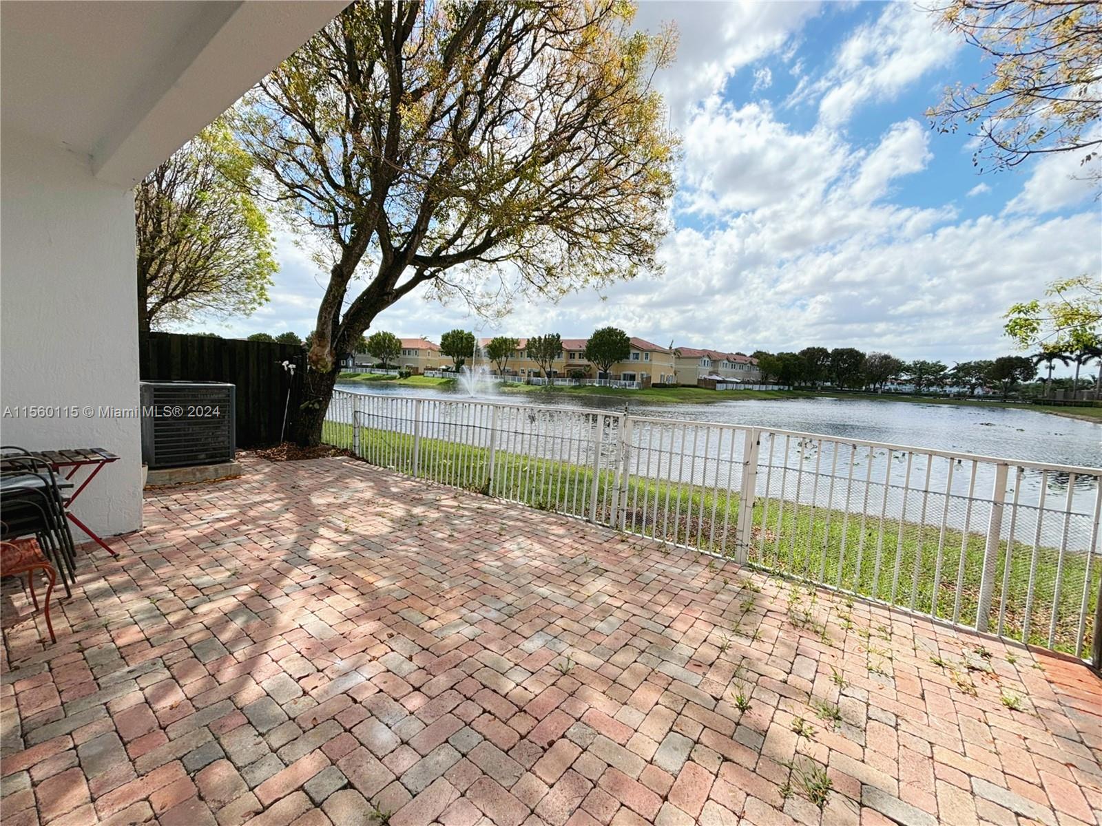 10860 Northwest 84th Street Doral, FL 33178 - Photo 8 of 19 a view of lake with outdoor space