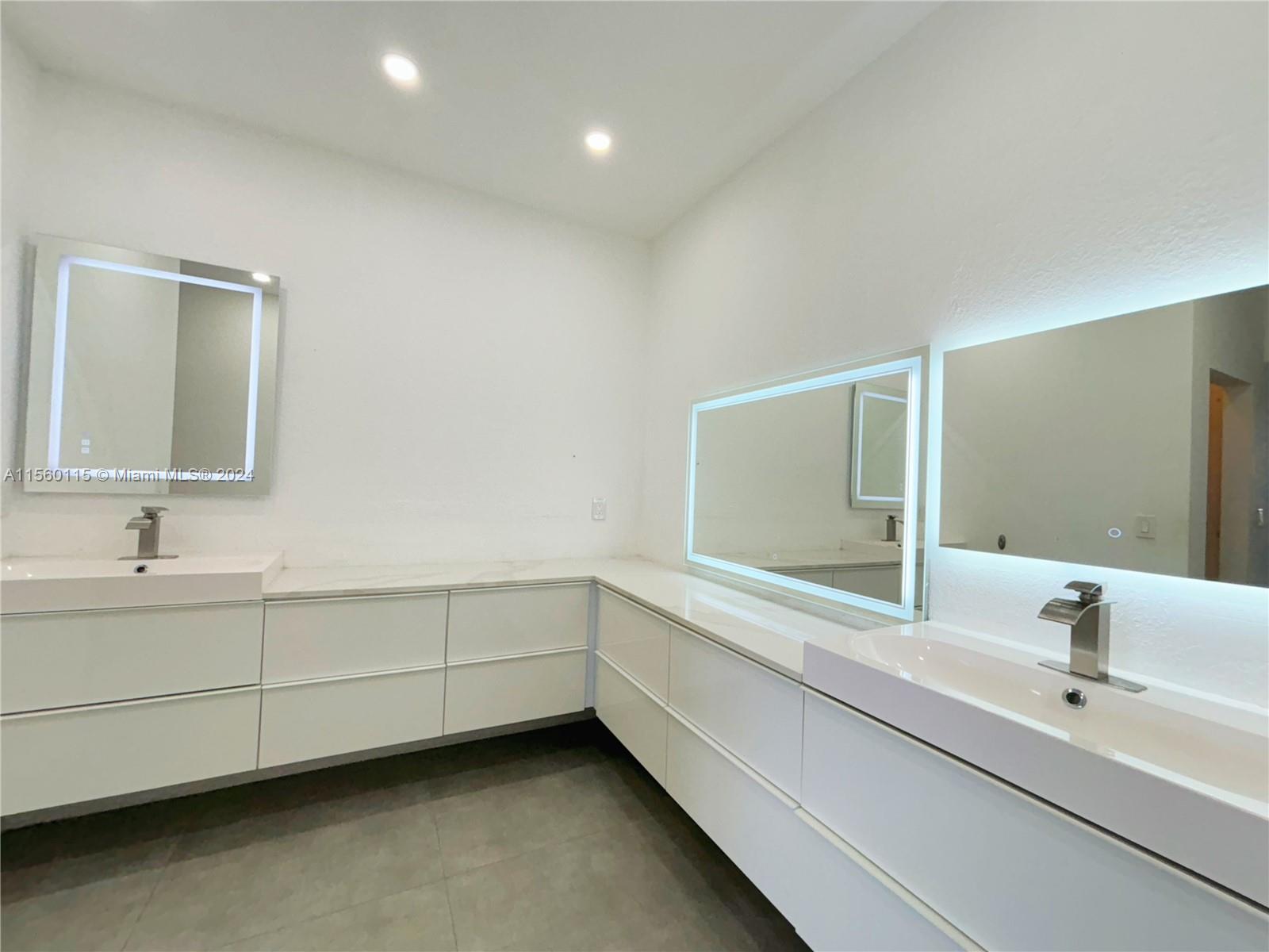 10860 Northwest 84th Street Doral, FL 33178 - Photo 9 of 19 a bathroom with a sink and a mirror
