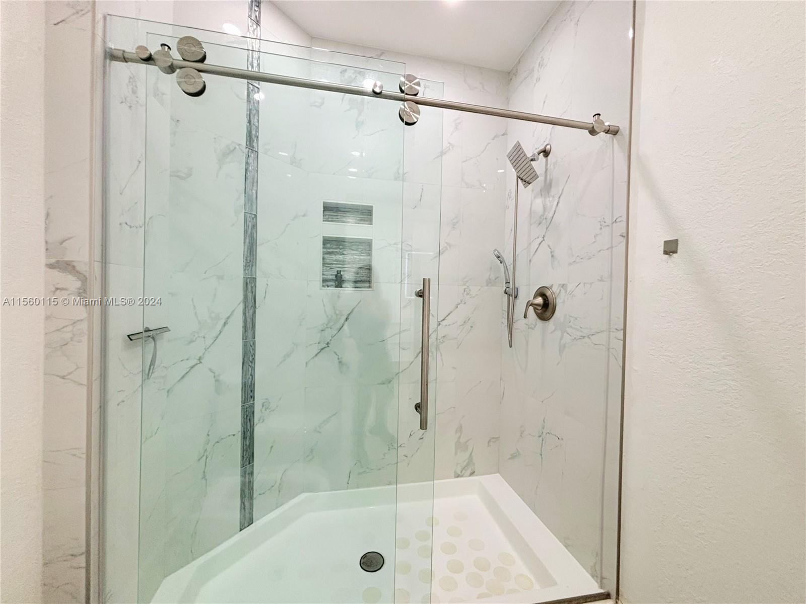 10860 Northwest 84th Street Doral, FL 33178 - Photo 10 of 19 a bathroom with a shower and a bath tub