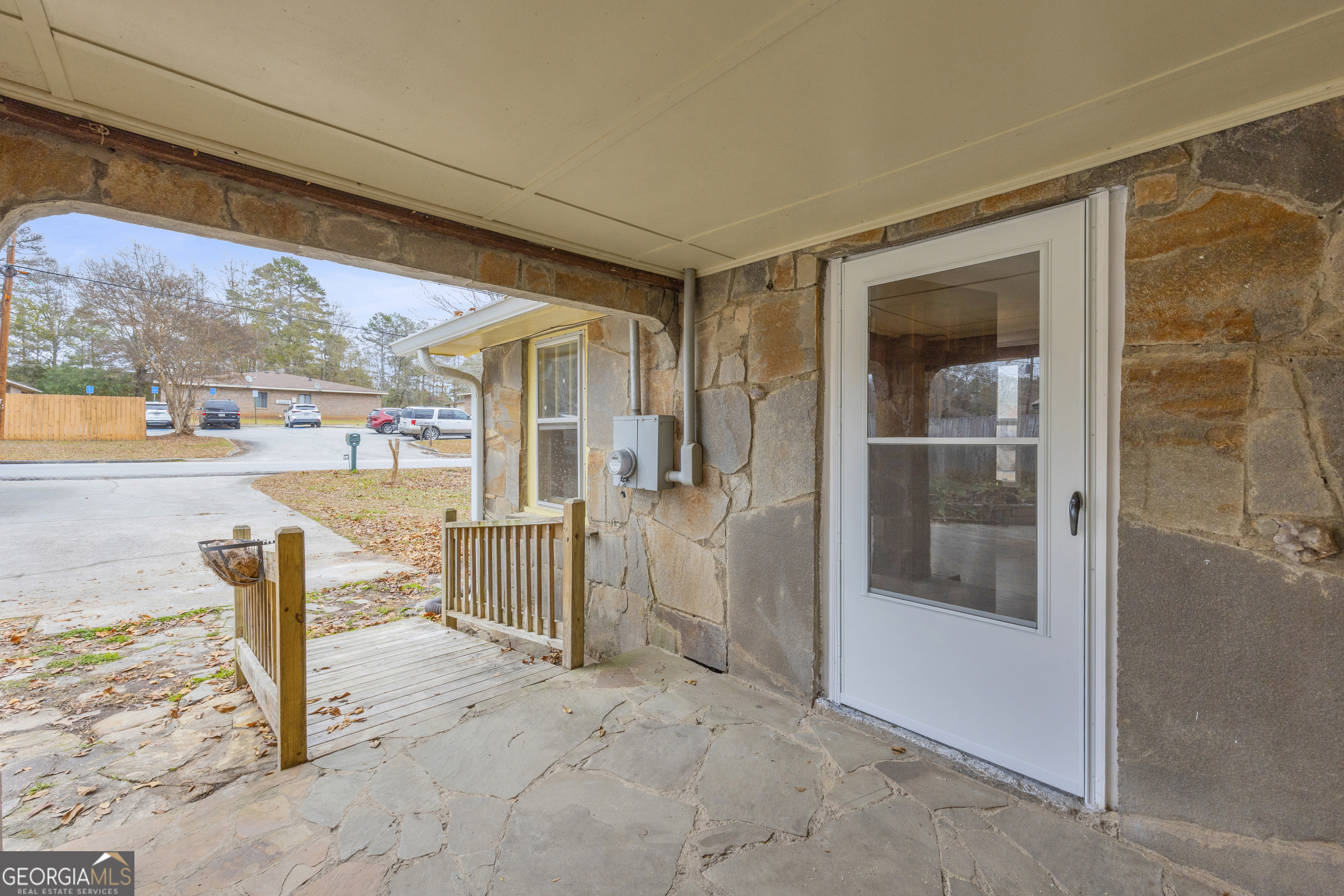 132 Queen Street Toccoa, GA 30577 - Photo 18 of 46 a view of a porch with furniture and floor to ceiling window