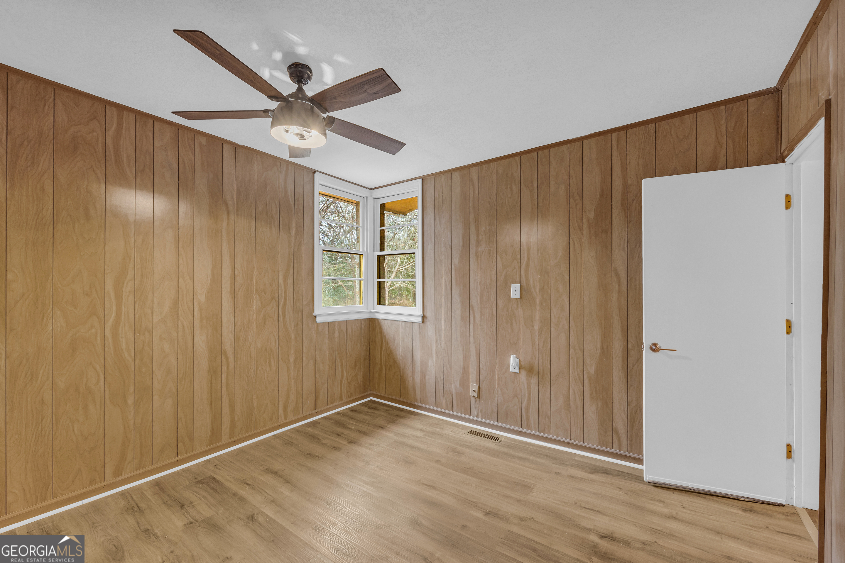 132 Queen Street Toccoa, GA 30577 - Photo 26 of 46 a view of an empty room with wooden floor