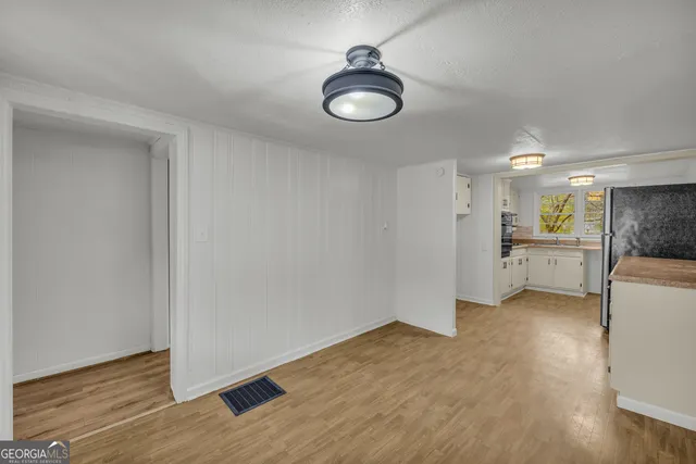 a view of a kitchen and a sink a kitchen