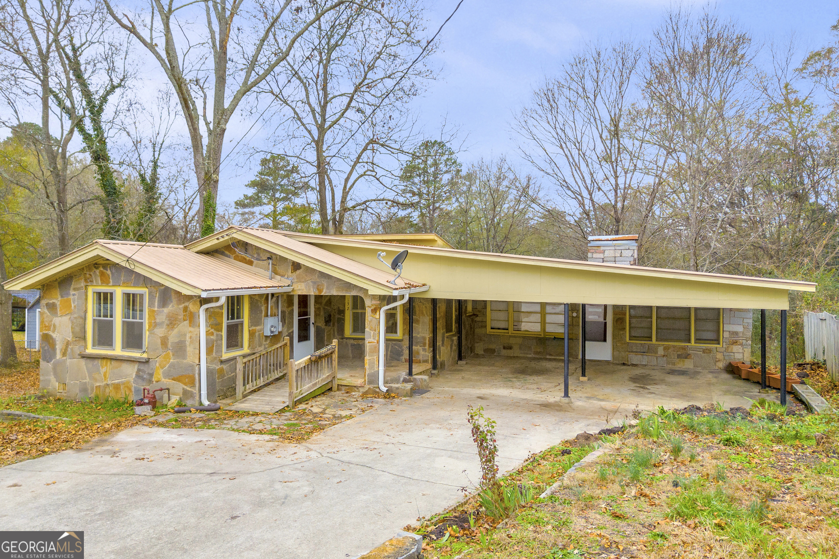 132 Queen Street Toccoa, GA 30577 - Photo 10 of 46 a front view of a house with a garden and trees