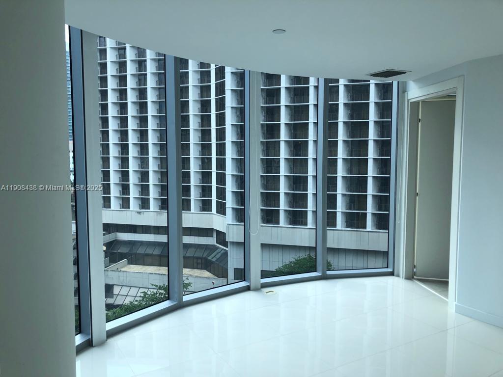 200 Biscayne Blvd Way, Unit 902 Miami, FL 33131 - Photo 2 of 23 a view of an empty room with a window