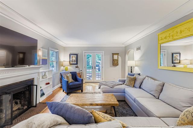 a living room with furniture fireplace and flat screen tv
