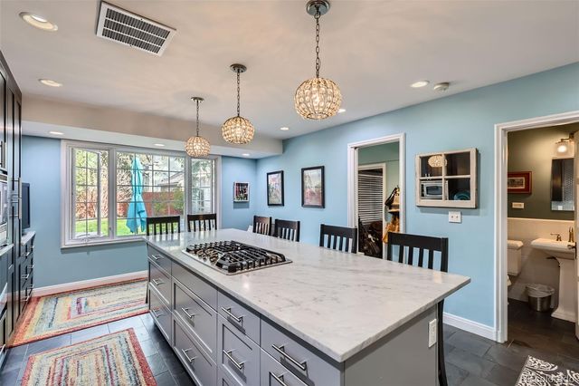 a kitchen that has a lot of cabinets